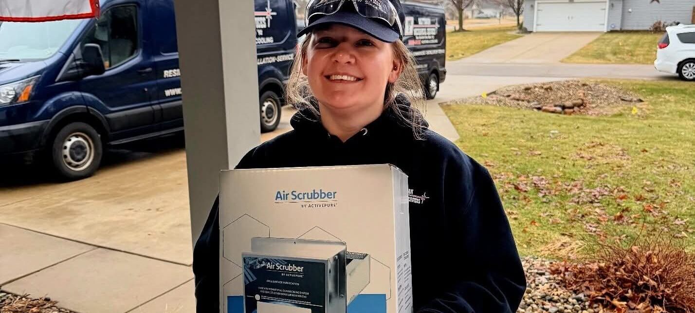Woman holding an airscrubber