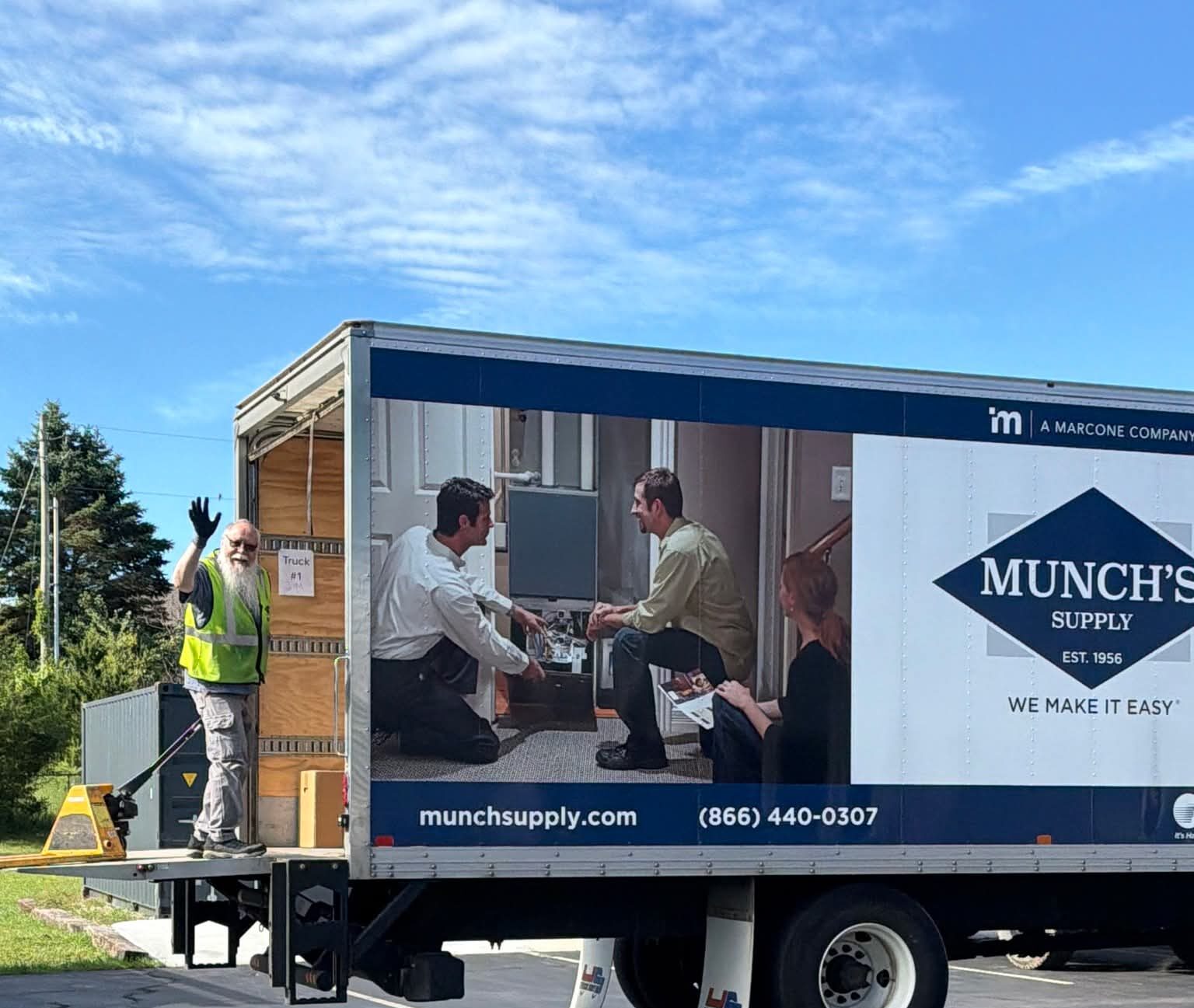 Guy standing behind the truck